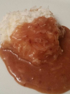 A picture of Frozen Coconut Cookie w/ Warm Plum Sauce.