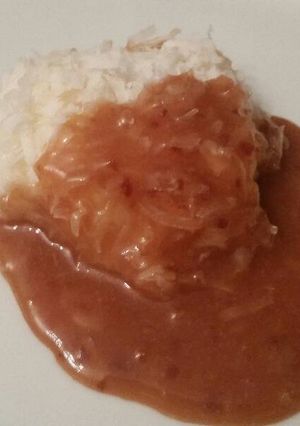 A picture of Frozen Coconut Cookie w/ Warm Plum Sauce.