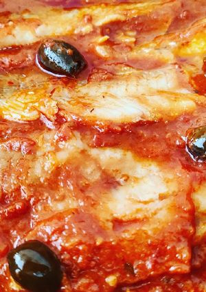 Foto di Filetti di merluzzo con pomodori e olive taggiasche