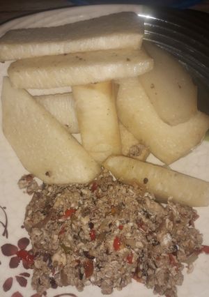 A picture of Fried yam with egg sources.