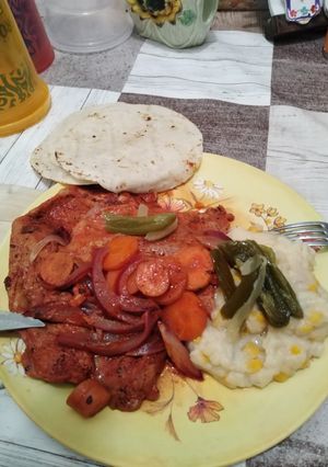 Una foto de O internacional 👨🏻🍳 milanesa de puerco
