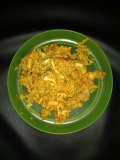 A picture of Cauliflower rice with smoked tofu in vegan sweet-mustard and ajvar sauce.