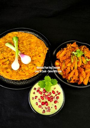A picture of Multigrain Masala Paratha - Ivy Gourd Sabzi - Mint Pomegranate Dahi Raita.