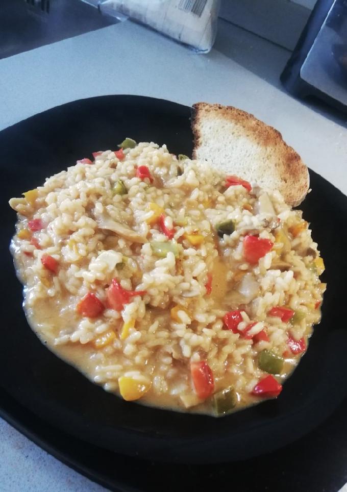 Una foto de Risotto de pimientos 🌶 y setas 🍄