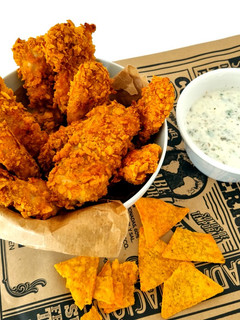 Una foto de Delicias de pollo al horno rebozados con doritos sabor tex-mex