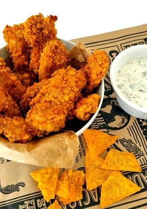 Foto principal de Delicias de pollo al horno rebozados con doritos sabor tex-mex