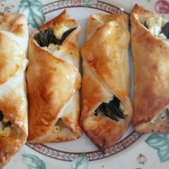 A picture of Feta and asparagus pastry wraps.