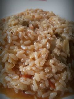 Una foto de Arroz meloso de alcachofa y tomate de ramallet