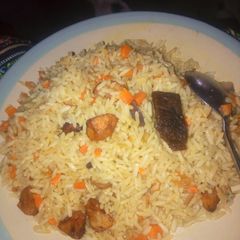 A picture of Fried Rice with chopped fried plantain.
