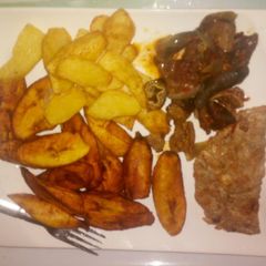 A picture of Fried Irish potatoes,plantain and egg sauce.