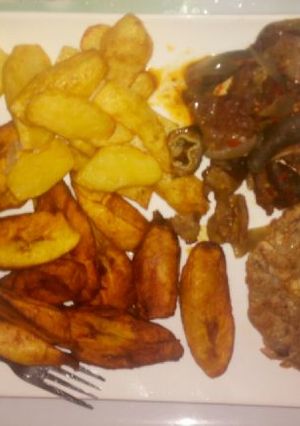 A picture of Fried Irish potatoes,plantain and egg sauce.