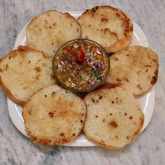 A picture of Garlic bread and ghugni.