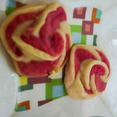 A picture of Sweet roses with sweet hearts.