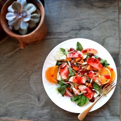 A picture of Mango peach salad with passion thyme vinaigrette.