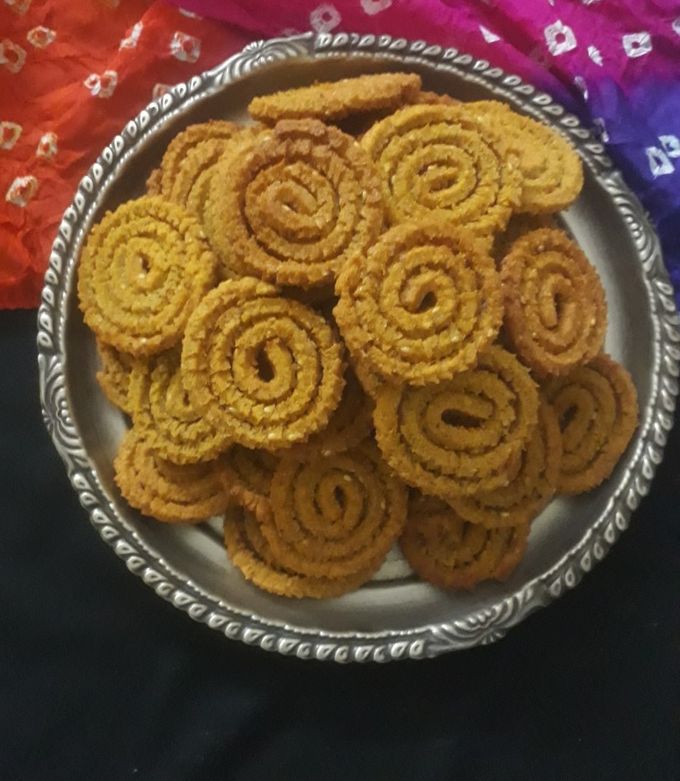 Golden spiral chakali arranged on a festive platter