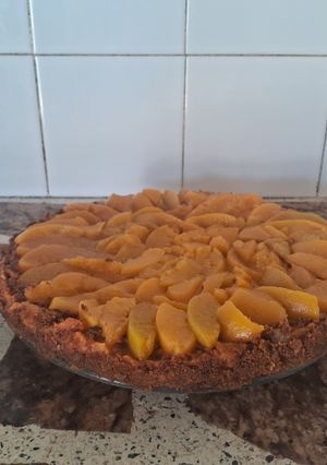 Una foto de Cheesecake de duraznos 🍑🍑
