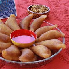 Pancakes stuffed with walnuts - atayef bi joz A picture of Pancakes stuffed with walnuts - atayef bi joz.