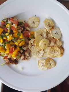 A picture of Blackened chicken with mango salsa.