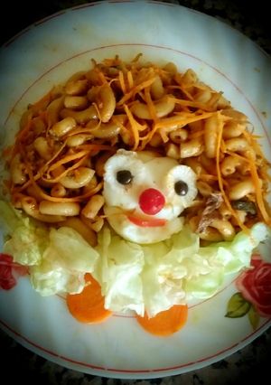 Une photo de Les pâtes au sauce tomate,carotte et l'œuf mollet 😋😋😋👍