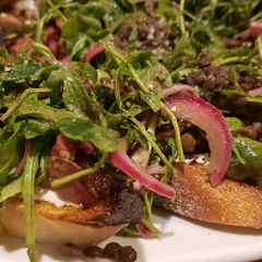 A picture of Lentil Salad Crostini with Chevre and Prosciutto.