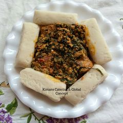 Egusi/ugu leaf soup with pounded yam A picture of Egusi/ugu leaf soup with pounded yam.