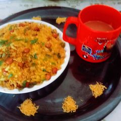 A picture of Healthy tasty Indori poha with masala tea.
