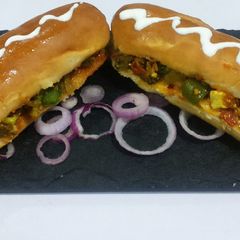 A picture of Paneer, broccoli, stuffed hot dog.