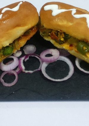 A picture of Paneer, broccoli, stuffed hot dog.