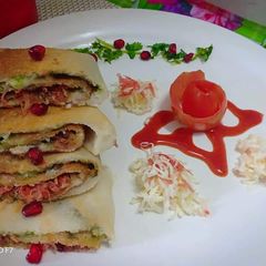 Carrot cheese pomegranate roll dosa A picture of Carrot cheese pomegranate roll dosa.