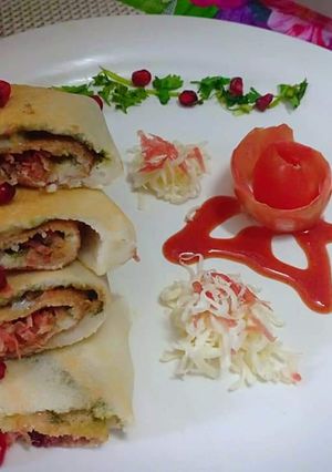 A picture of Carrot cheese pomegranate roll dosa.