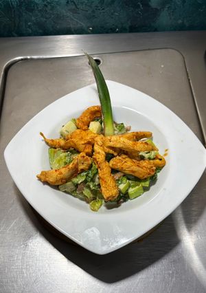 A picture of Chicken Marinated and Cooked with Grapefruit Juice and Chipotle Peppers.