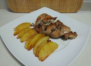 Foto principal de Conejo asado con gajos de patata