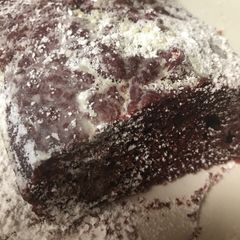 Red velvet cake with powdered sugar on top A picture of Red velvet cake with powdered sugar on top.