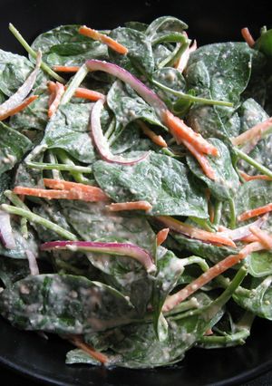 A picture of Spinach Salad with Hummus Dressing.