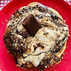 A picture of Pancakes with delectable sweet toppings.