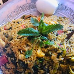 A picture of Veg biryani in electric rice cooker.