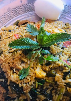 A picture of Veg biryani in electric rice cooker.