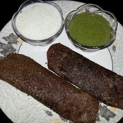 A picture of Stuff paneer dosa with coconut chutney.