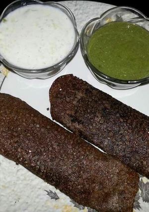 A picture of Stuff paneer dosa with coconut chutney.