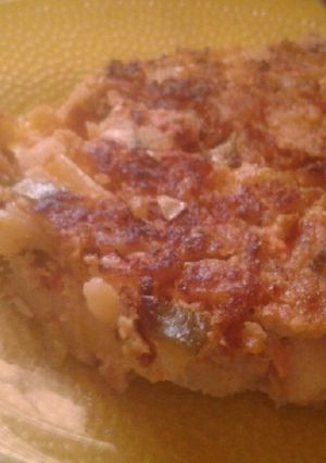 Una foto de Tortilla de zucchini, papa, zapallito tierno y tomate