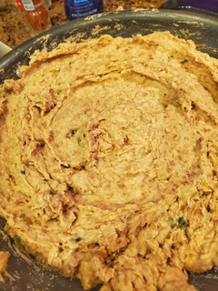 A picture of Refried beans made in a rice cooker.