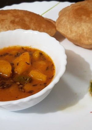 A picture of BOKAKHAT POORI AALU BHAJI With Green Chilli Chutney.