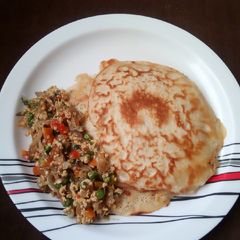 A picture of Pancake with veg sauce.
