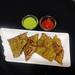 A picture of Veggie loaded moong dal chilla.