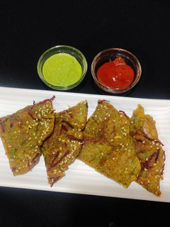 A picture of Veggie loaded moong dal chilla.