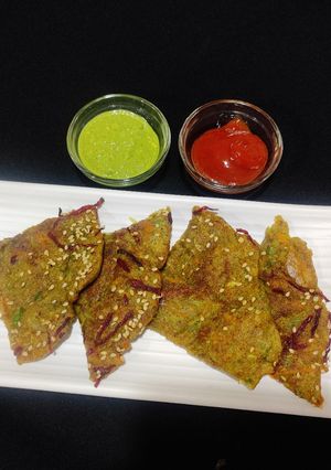 A picture of Veggie loaded moong dal chilla.