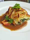 Beef wellington with onion gravy sauce