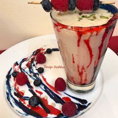 A picture of Raspberry and blueberry Thandai.