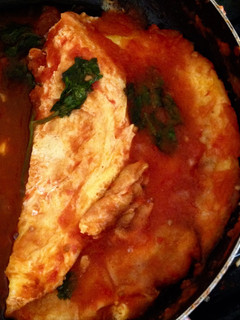 Una foto de Huevo en salsa de tomate