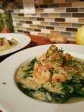 Butter poached shrimp with parmasan spinach orzo risotto